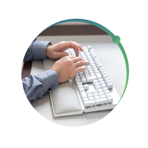 Close up of conquest wildman team member typing on a keyboard