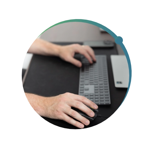Close up shot of Conquest Wildman team members hands typing on a keyboard