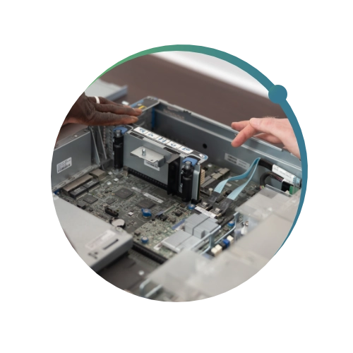 Close up shot of conquest wildman team members fixing a computer