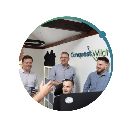 Conquest Wildman team in the office together