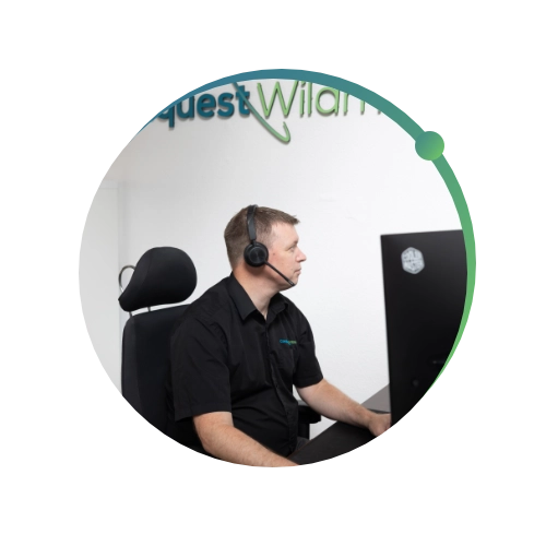 Conquest Wildman team member helping client with IT Support