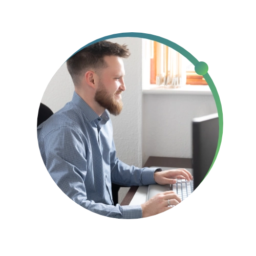 Conquest wildman team member typing on the computer