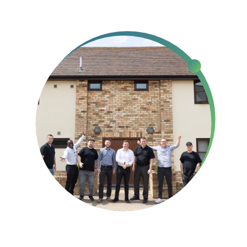 Conquest wildman team standing outside the office